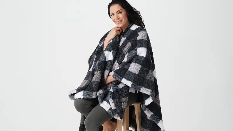 Woman wearing checkered cape