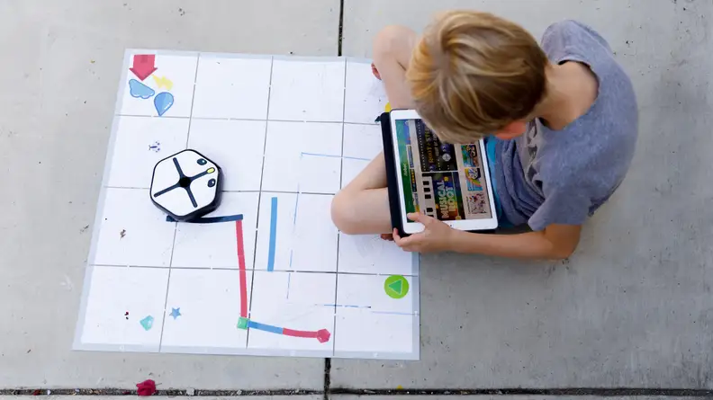It looks like a robot vacuum, but it's actually a coding toy.