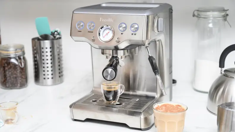 A silver espresso machine on a kitchen counter.