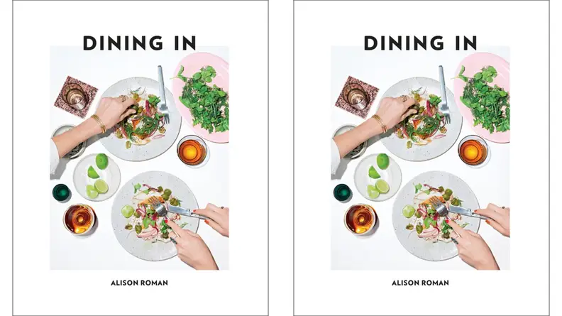 A couple of individuals, standing just out of frame, prepare dinner at home. (This is the cover for a book called Dining In, by Alison Roman.)