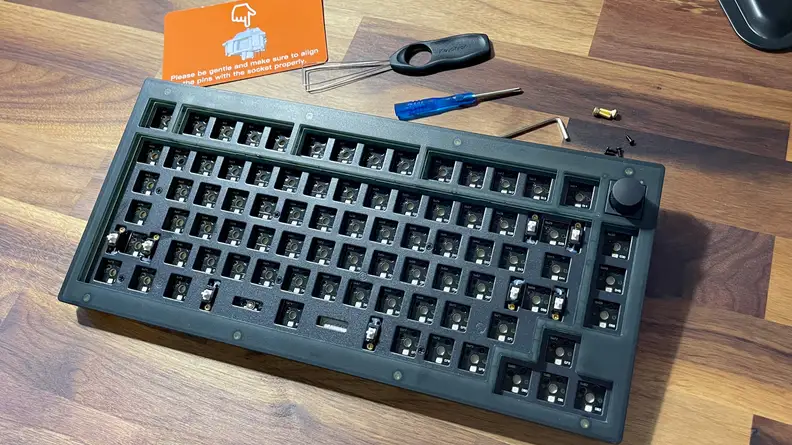 An empty keyboard without keycaps or switches.
