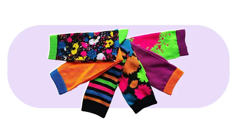 Multicolored, patterned calf-length socks gathered in sem-circle.