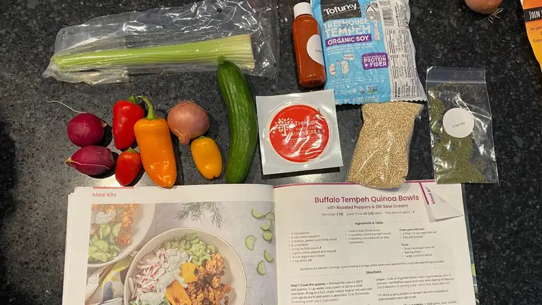 The meal recipe instructions card along with meal ingredients.