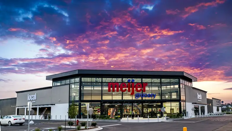 Meijer Grocery storefront under a vivid sunset sky