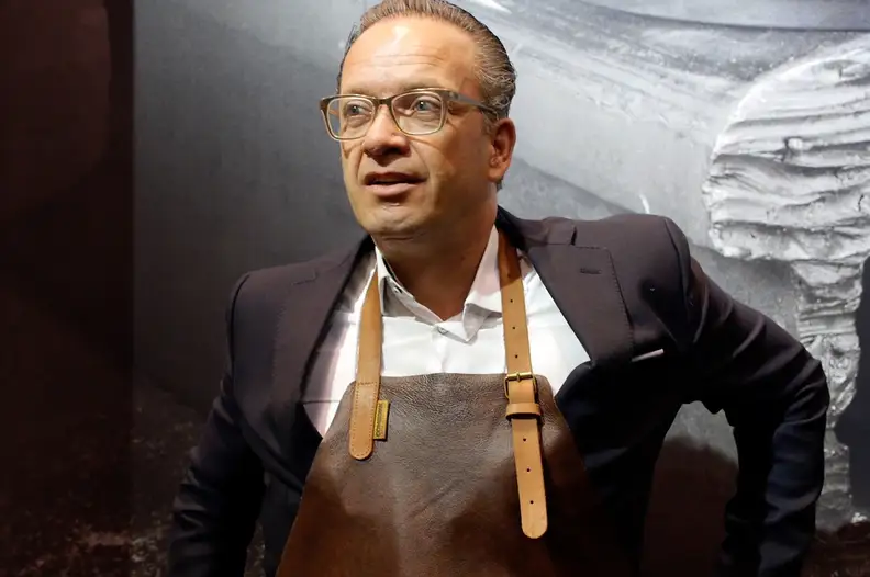 Joost Van Damme of Combekk models one of the company's new leather aprons.