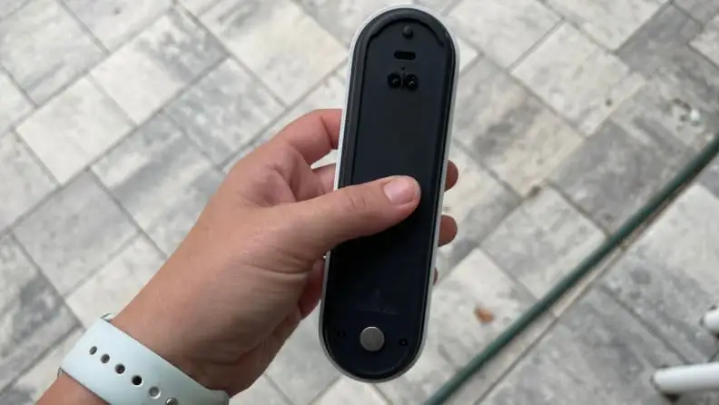 Holding the Nest Doorbell in one's hand
