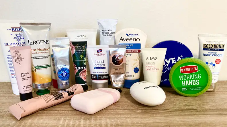 All of the hand creams sitting on a table.