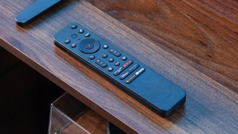 The Sony Bravia 9 TV remote on a wood table.