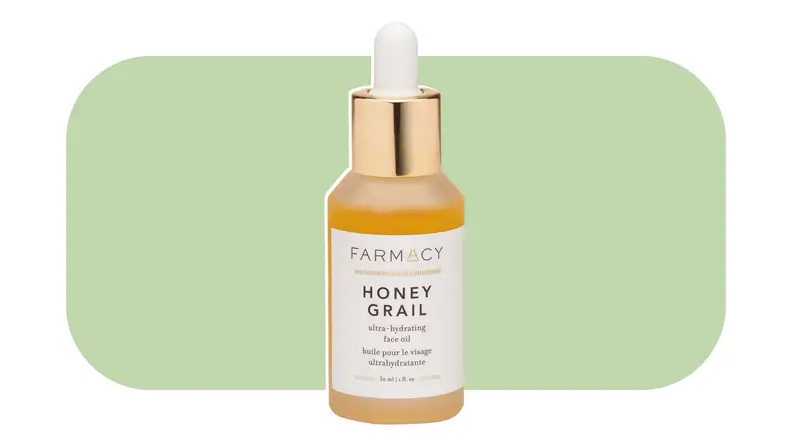 Farmacy face oil in front of a light green background.