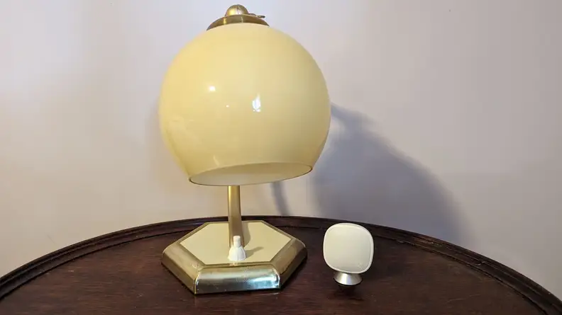 An Ecobee SmartSensor is shown positioned next to a lamp.