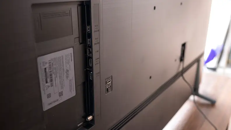 The rear of the TV, showing a vertical line of ports for audio video connections