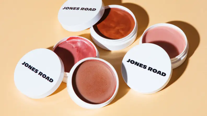 Different shades of compacts skin balms.