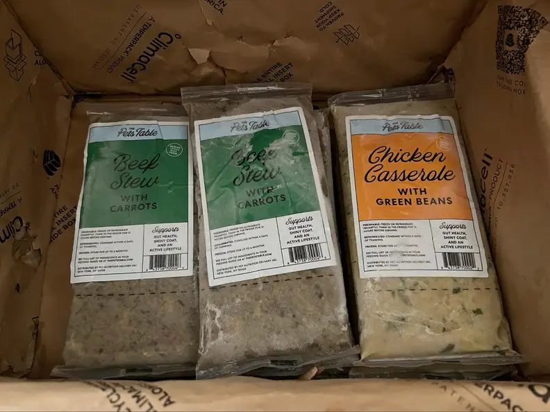 Three bags of The Pets Table fresh food.