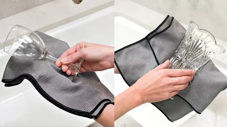 Drying glasses with dish cloth.