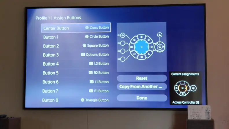 A photo of a TV with the button assignment screen showing.