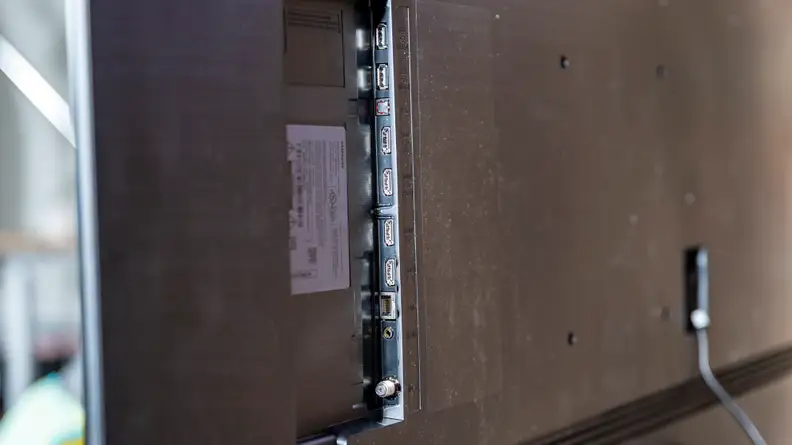 A close-up of the Samsung Q70A's various connectivity options on the back of its panel