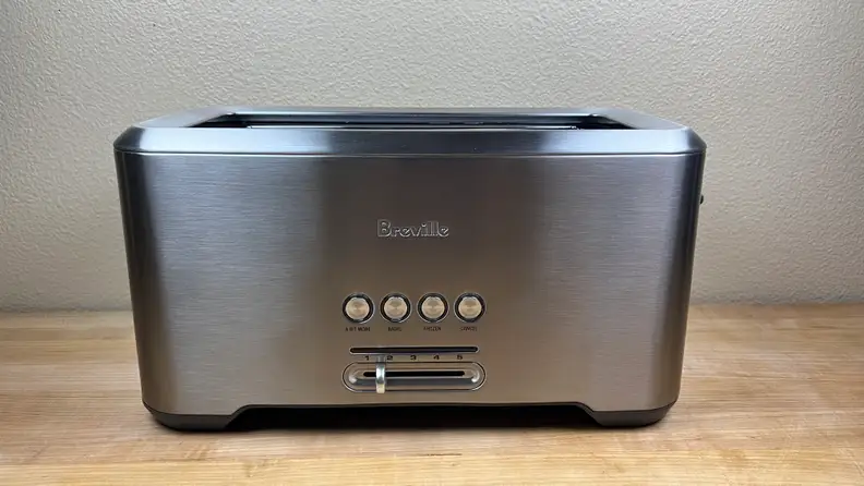 Breville stainless steel 4-slice toaster shot on a countertop