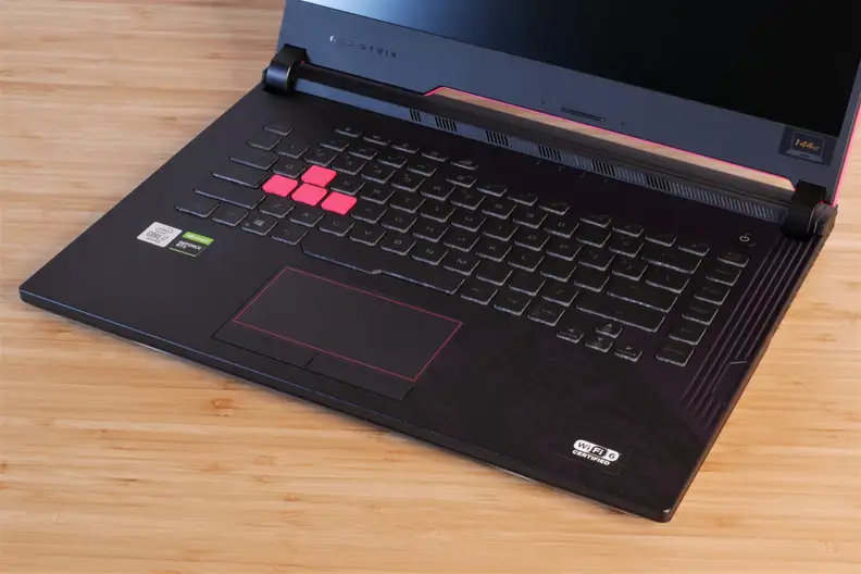 A photo of the Asus ROG Strix G512LI gaming laptop on a desk with keyboard shown