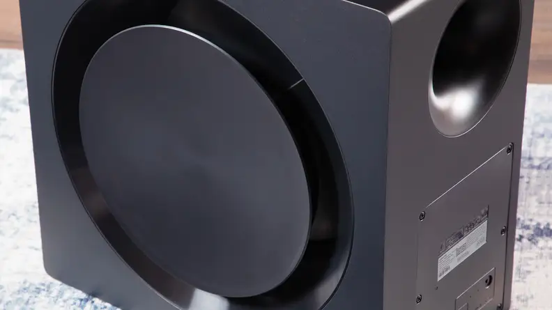 The Samsung HW-Q990C subwoofer on a carpet.