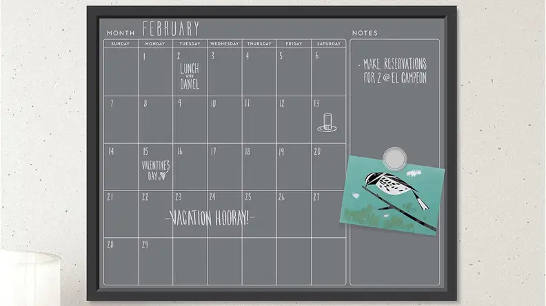 U Brands Magnetic Chalk Calendar Board hanging on a wall