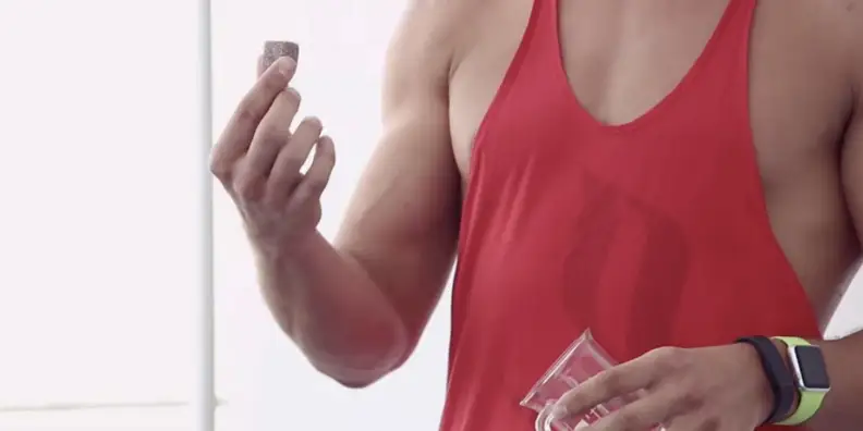 A man holding a Go Cube coffee cube