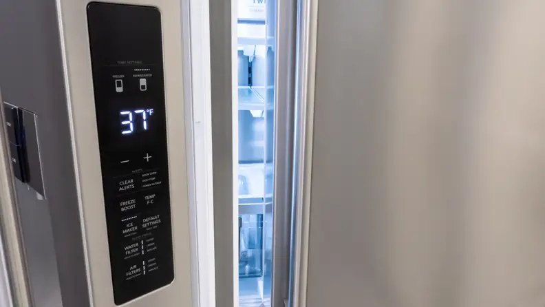 A close-up of the Frigidaire Pro PRMC2285AF counter-depth French-door refrigerator's controls, which are located on the edge of the left door.