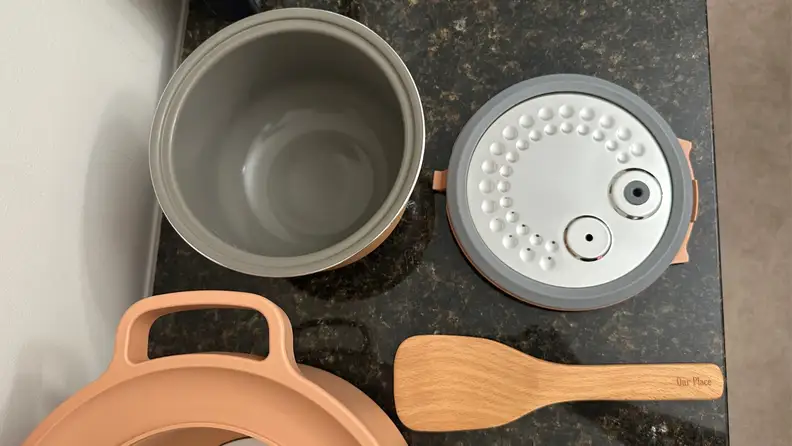 Removable inner cooking pot and inner lid liner of Our Place Rice Cooker