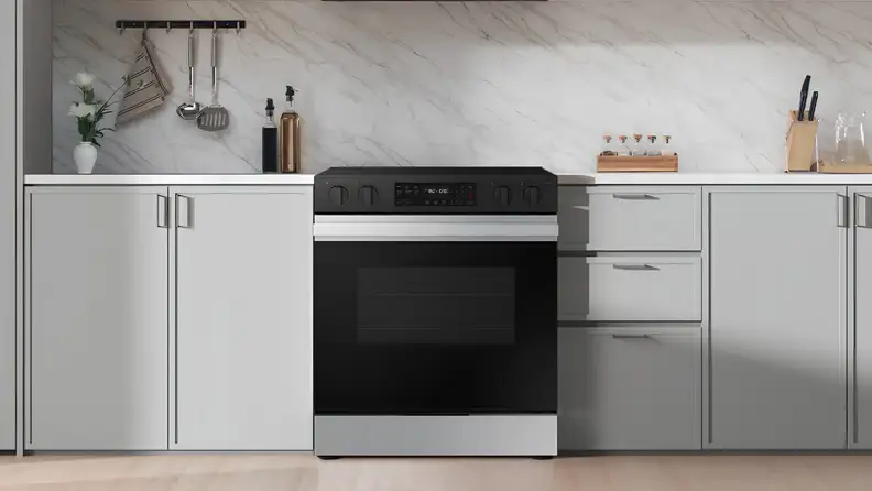 Black-and-white freestanding electric range installed in a modern kitchen.