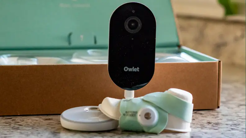 Owlet Dream Sight camera and Dream Sock with packaging.