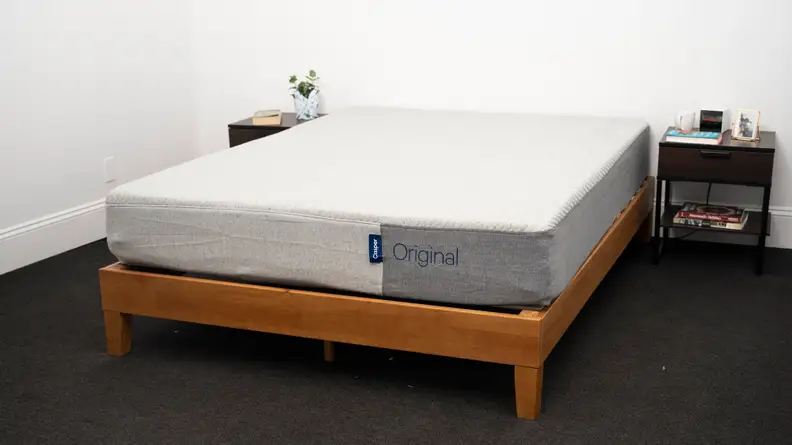 the Casper Original Mattress sits on a brown bed frame