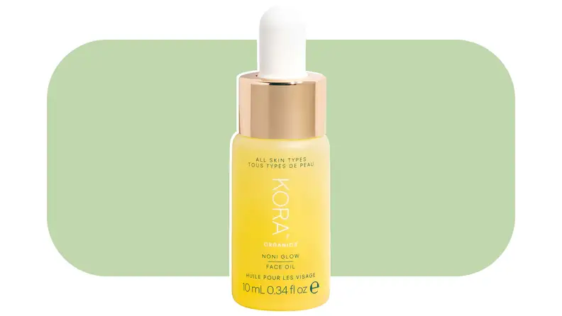 Kora Organics face oil against a light green background.