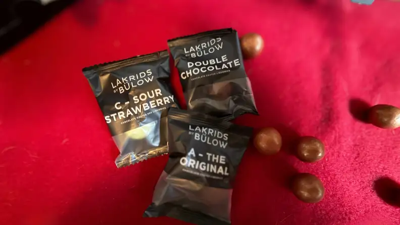 Chocolate licorice samples on a red background