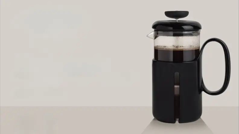 OXO French press on beige background