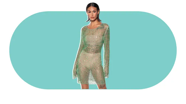 A model wearing a green embellished mini dress.