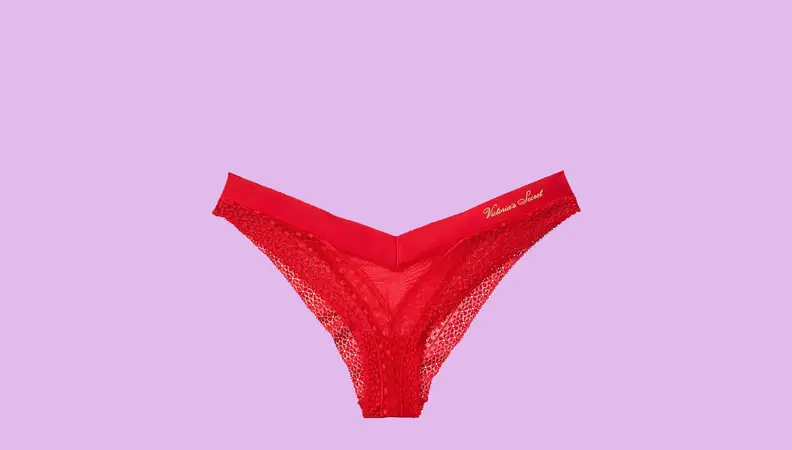 A pair of red underwear against a hot pink background.