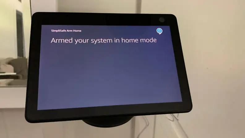 Amazon Echo Show 10 controlling a SimpliSafe wireless home security system.