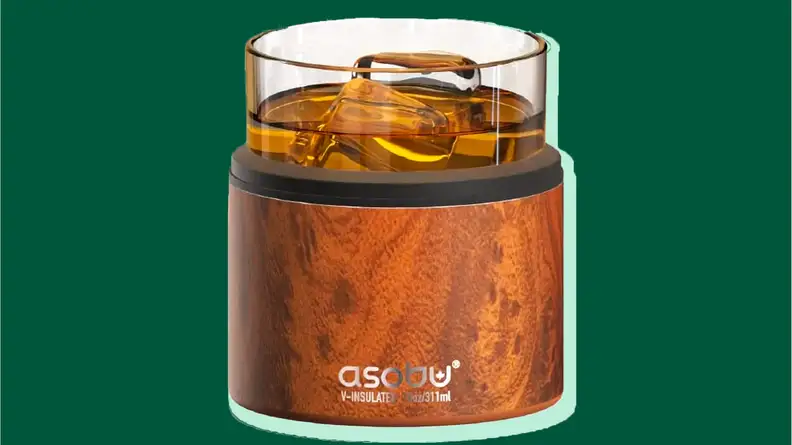 Whiskey Glass on a green background