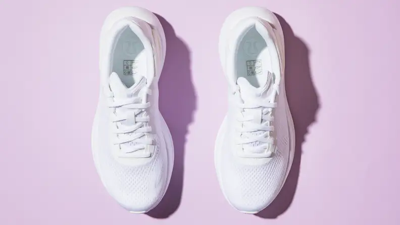 An aerial view of a white pair of lululemon Beyondfeel sneakers.