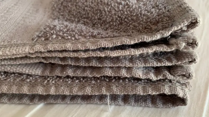 Close-up of gray towel fraying on the edges