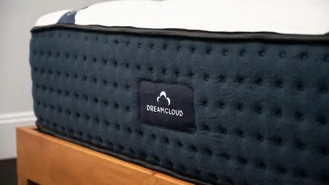 Close up of navy blue DreamCloud mattress.