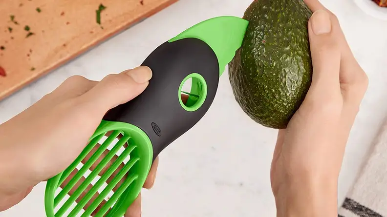 This handy tool opens, pits, and slices avocados.