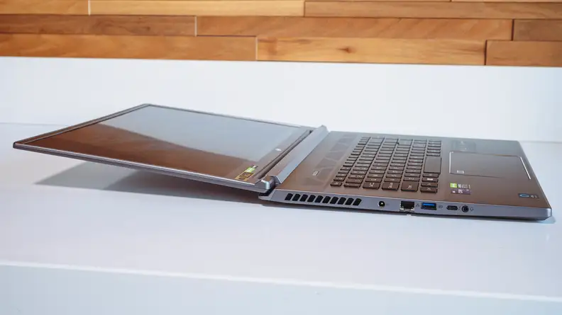 The laptop lies flat on the table.