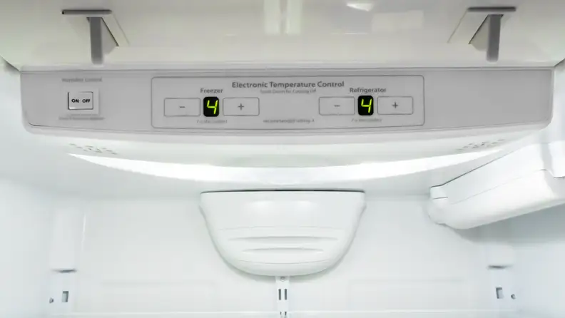 On the inside ceiling of a refrigerator, an electronic panel offers controls for fridge temperature, freezer temp, and humidity.