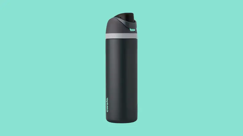 Black water bottle against teal background