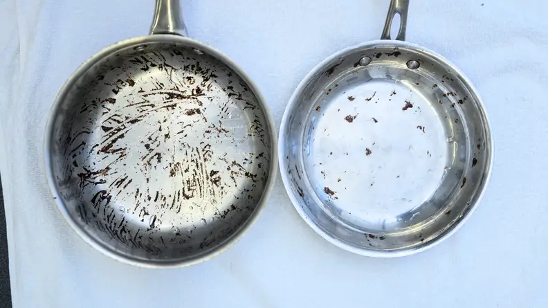 The pot with the tomato sauce stain (left) and the skillet with the brownie stain (right) soaked for 24 hours, and were then lightly hand-scrubbed.