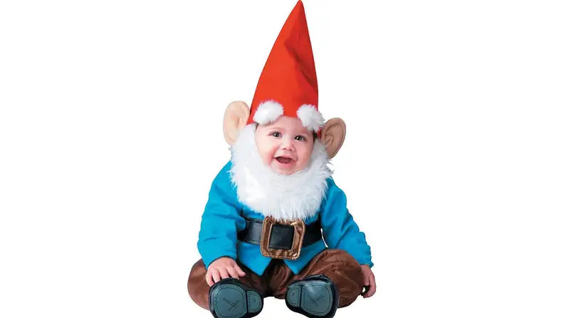 A baby dressed as a garden gnome.