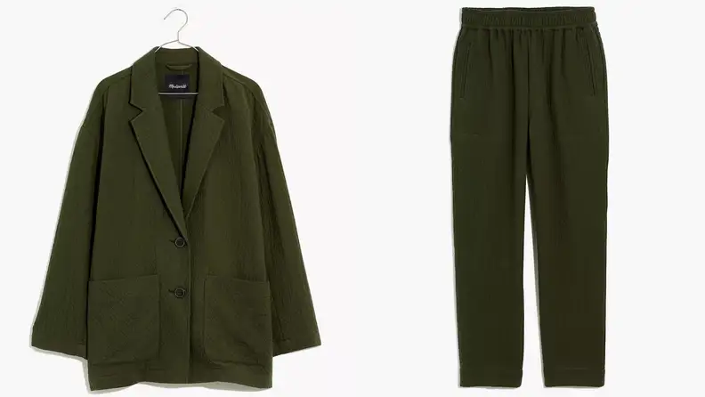 A dark green blazer and dark green pants.
