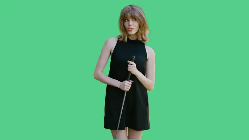 woman wearing black dress on green background
