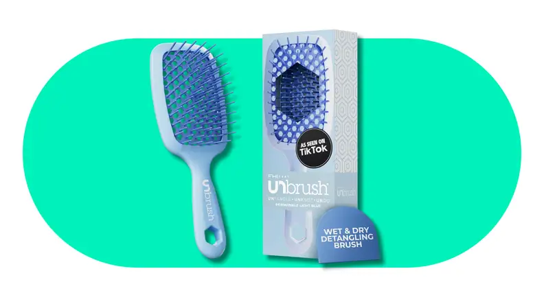 Blue detangling hair brush displayed next to its retail packaging.