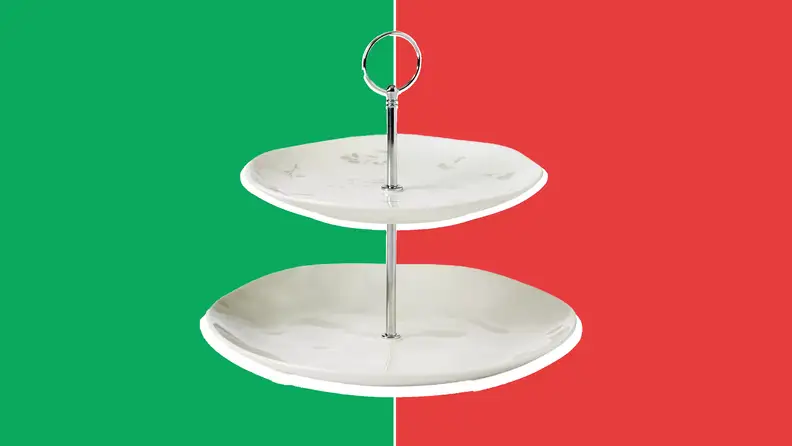 White, porcelain two-tier platter in front of a red and green collage.